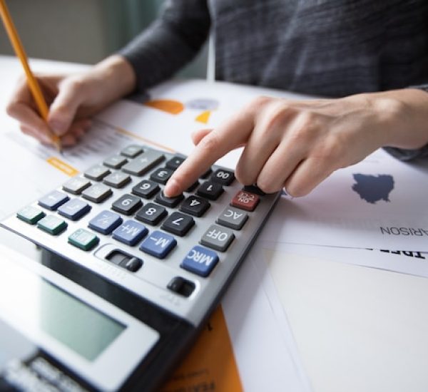 close-up-female-hand-counting-with-calculator_1262-3167