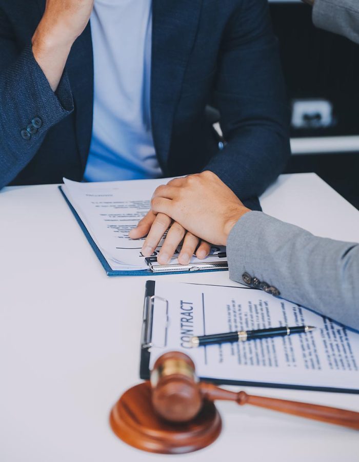 Consultation and conference of Male lawyers and professional businesswoman working and discussion having at law firm in office. Concepts of law, Judge gavel with scales of justice.